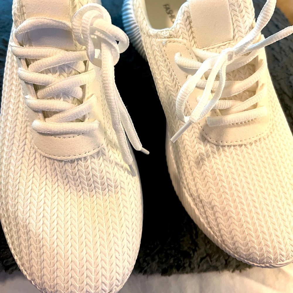 Brand new white women’s size 11 sneaker.